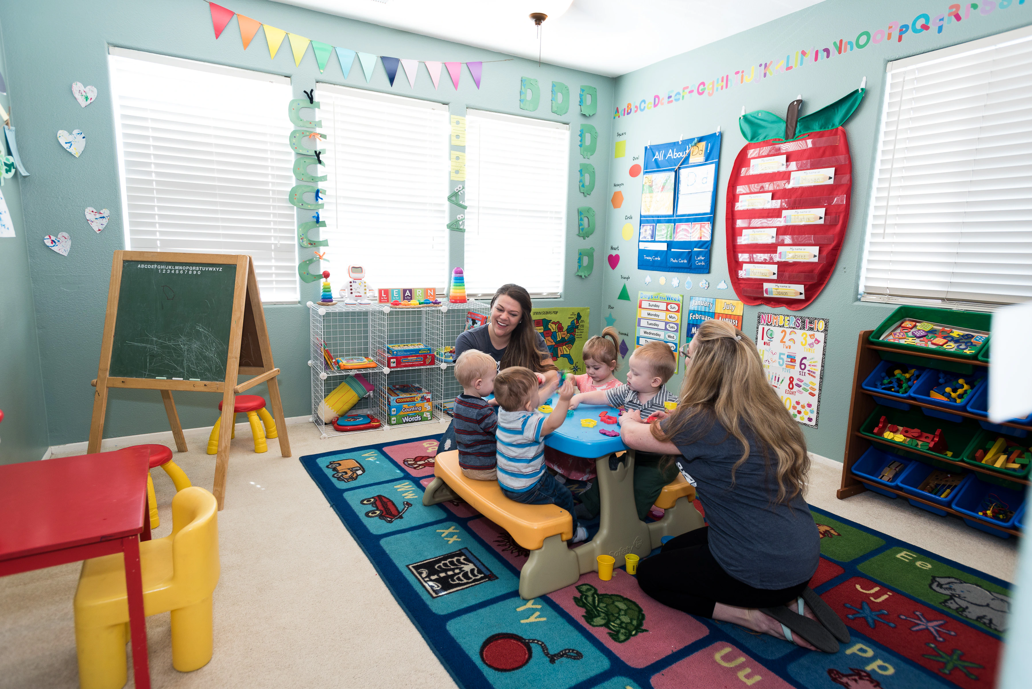 Daycare providers helping children