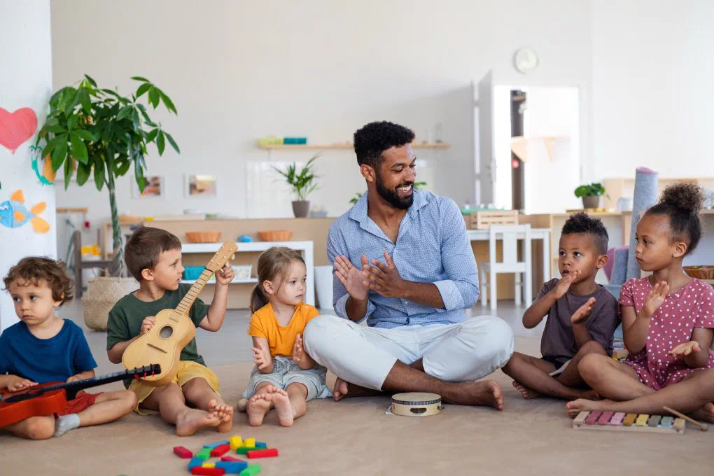 Children singing and playing together at an Upwards home daycare