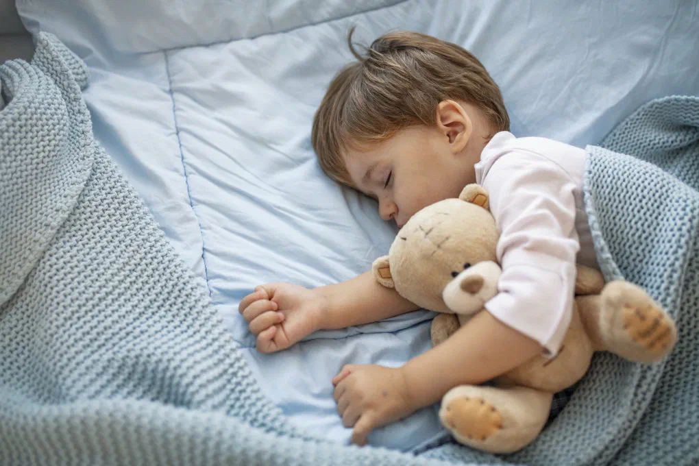 A sleeping baby cared for overnight at a home daycare